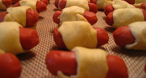 Making pigs in a blanket was a "true test of patience and stealth" for the author