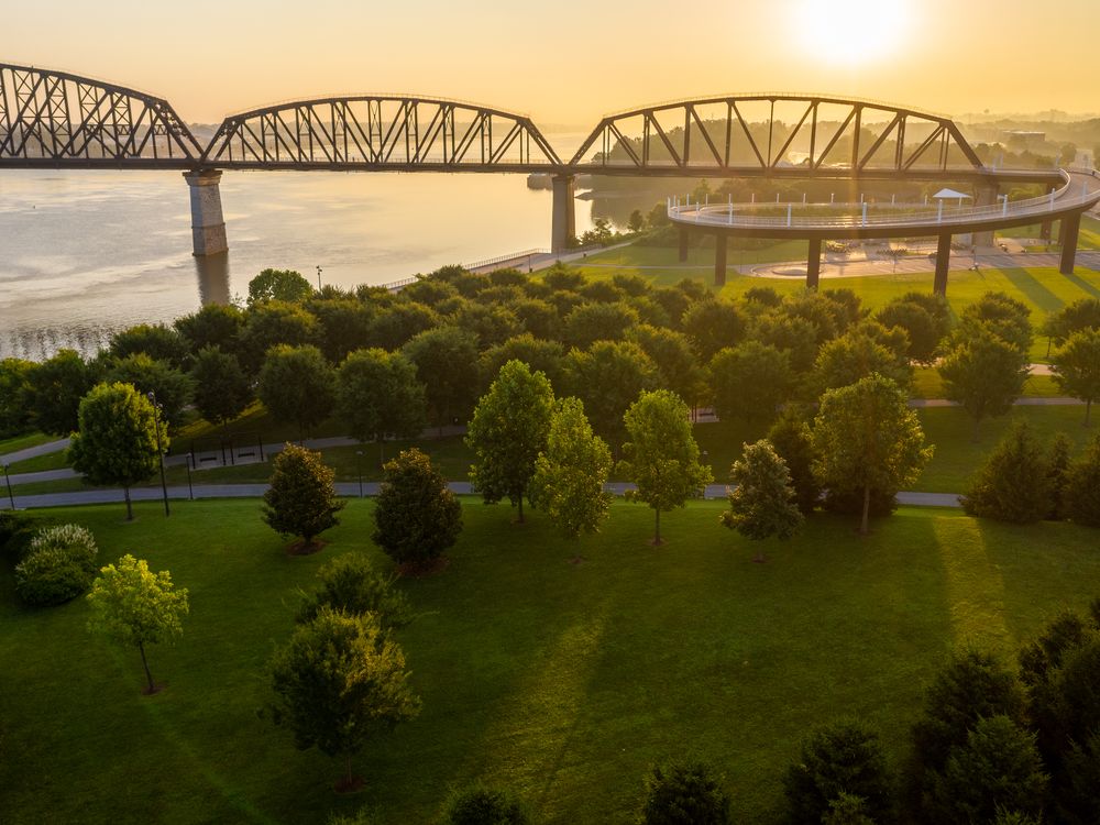 Bridge crossing a river at sunset