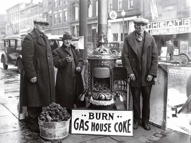 three men selling coal on the street