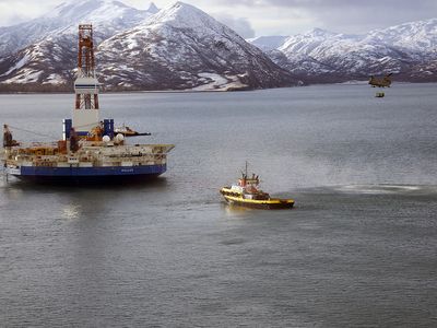 A Chinook helicopter caries supplies to the stranded Kulluk oil drilling platform in January.