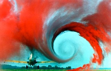 The swirling wing vortex from an agricultural airplane is highlighed during tests at NASA's Wallops Flight Facility.