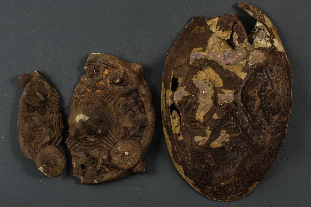 Two Viking artifacts with measurement marker underneath