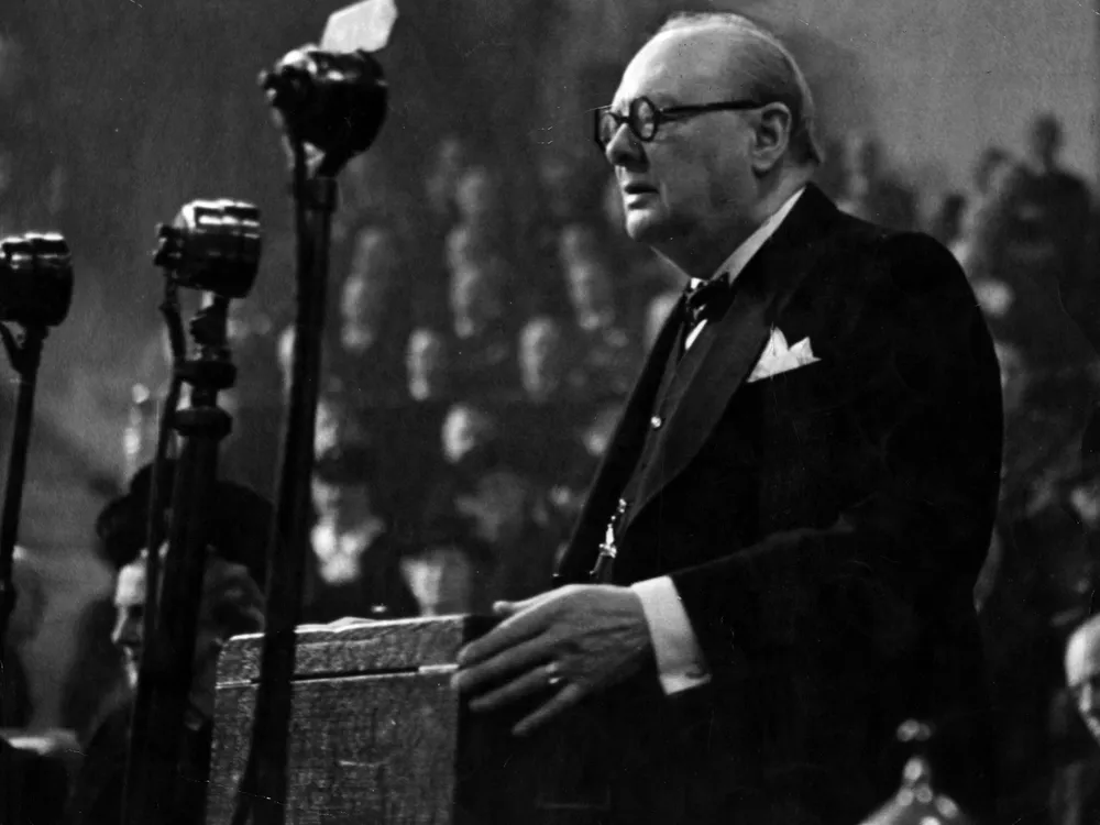 Black and white photo of Winston Churchill giving a speech