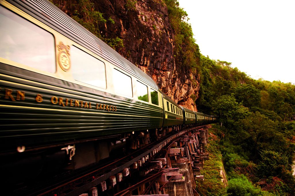 Dark green train on tracks