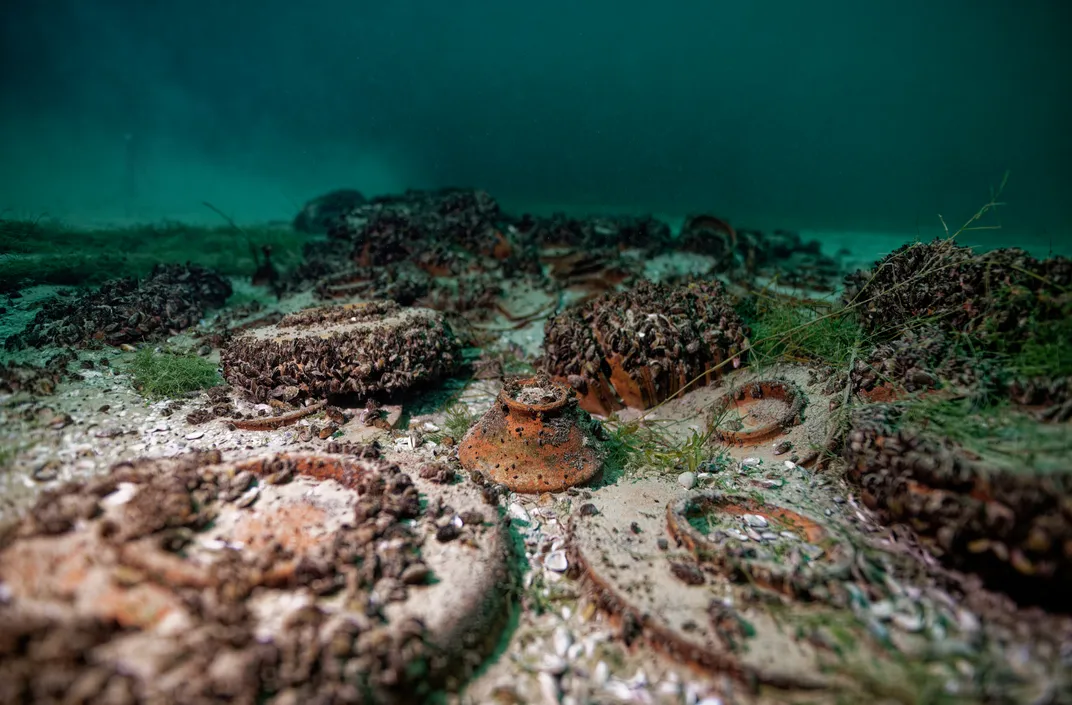 Artifacts covered in sediment at the bottom of a lake