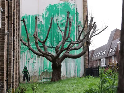 A bright green Banky mural appeared on a residential building in London on St. Patrick&#39;s Day.