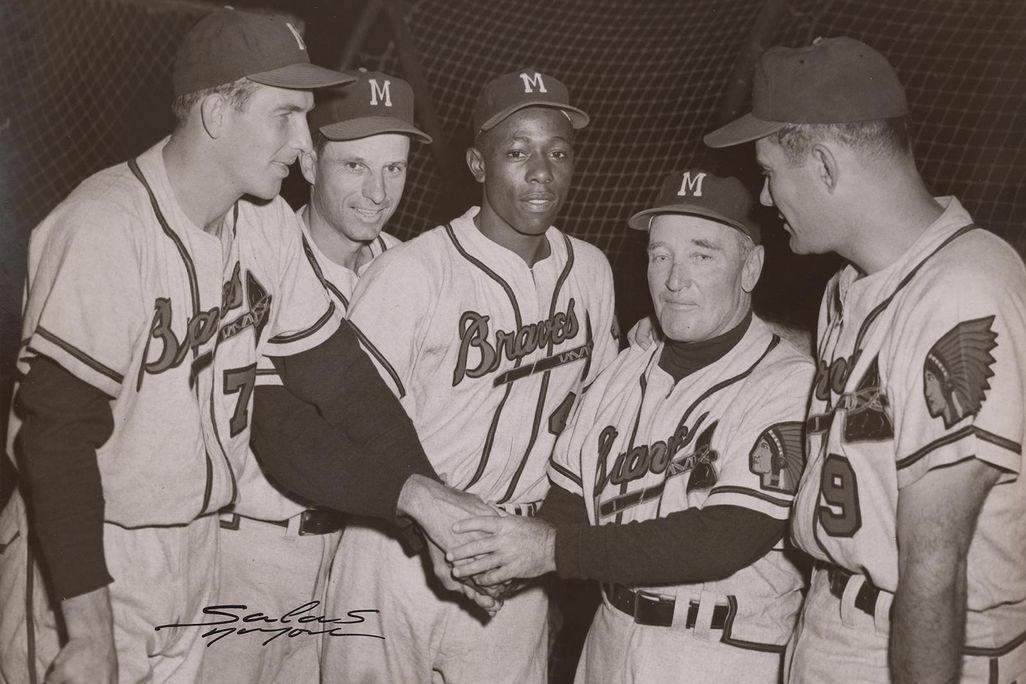 Hank Aaron (center) poses with his teammates in this 1956 photograph by Osvaldo Salas