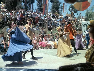 Performers at the 1963 Renaissance Pleasure Faire. Ron Patterson, a co-founder of the event, appears in orange at the far right.