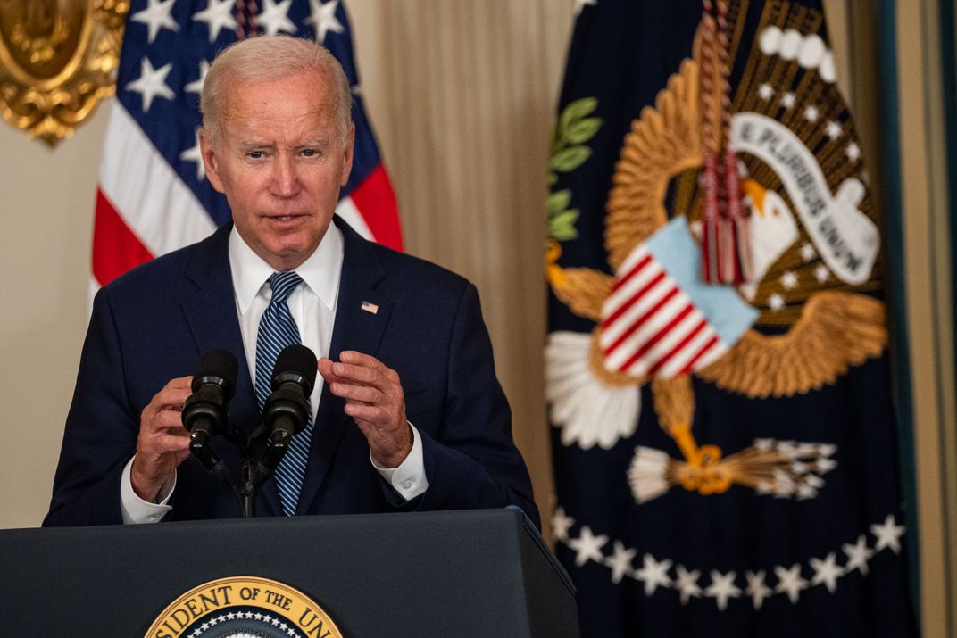 Joe Biden speaks at a podium