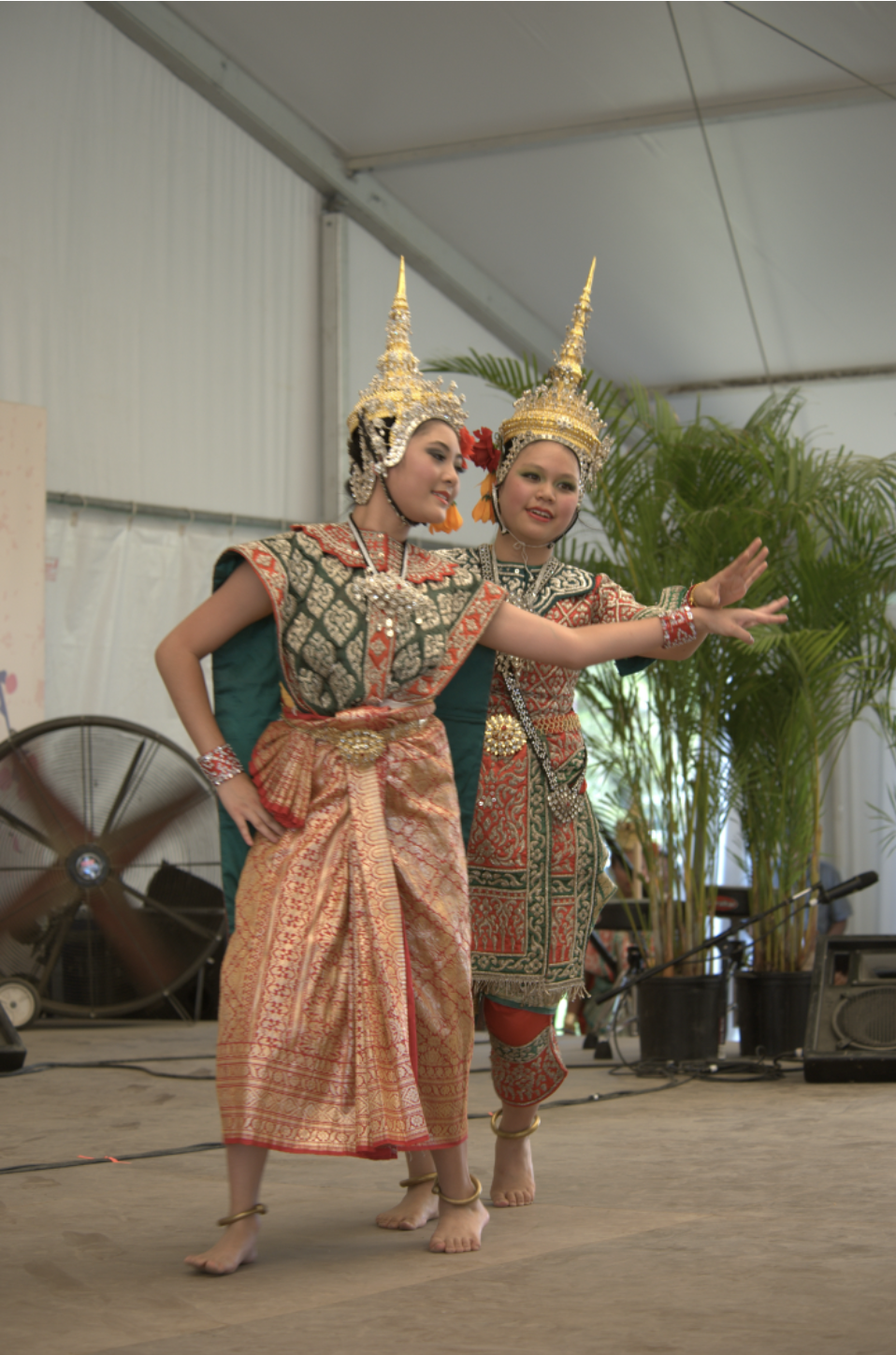 Two dancers in Thai costume.