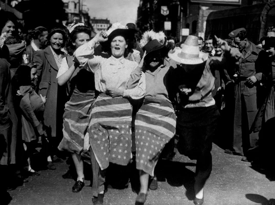 Women wrapped in flag