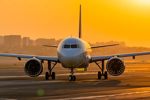 An Airbus A320neo taxiing during the golden sunset hours. thumbnail