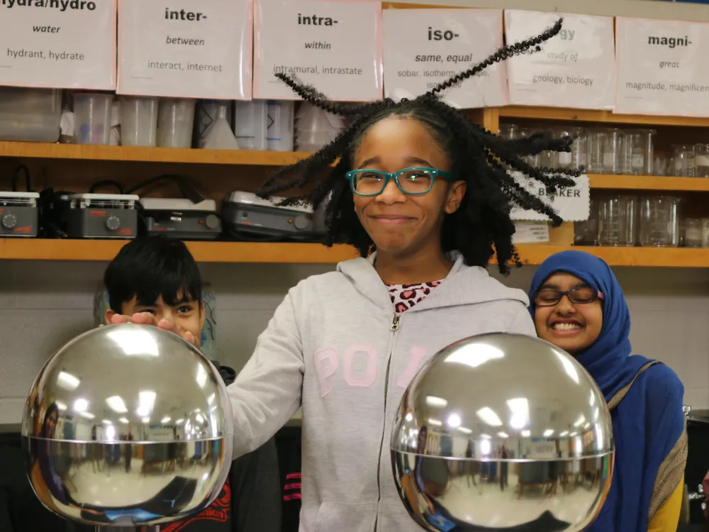 Moments that highlight the joy and excitement of scientific inquiry—such as this student using a Van de Graaff generator—can spark interest in a STEM-related career. Here are some career-focused resources that can supplement that interest. (National Air and Space Museum)
