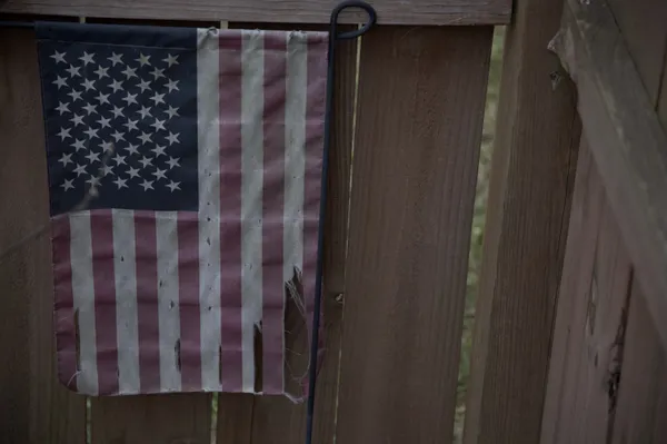 A weathered American flag retains its glory thumbnail