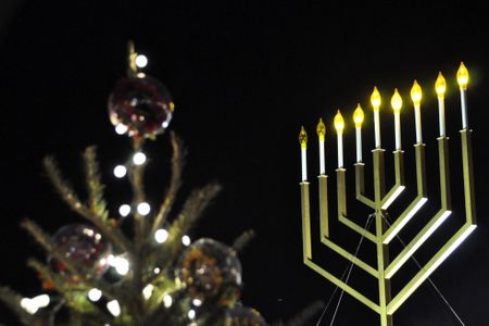 The National Menorah and one of the state Christmas trees near the White House in 2009. 