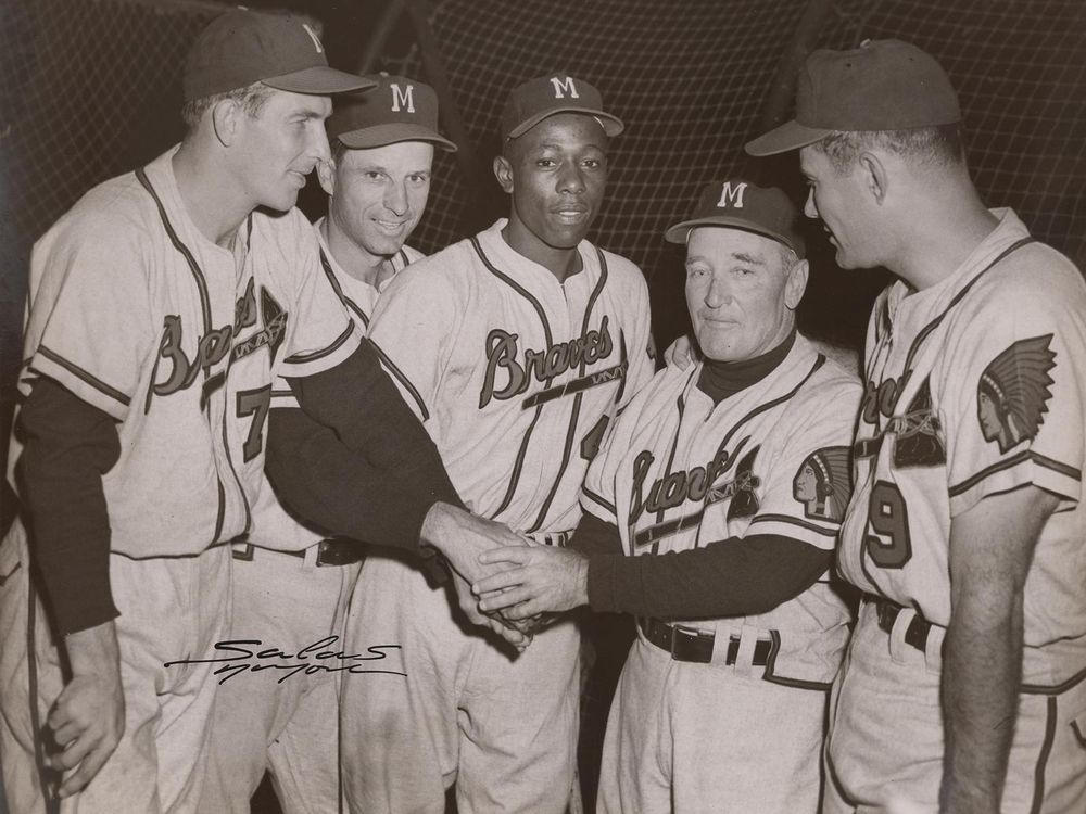 Hank Aaron (center) poses with his teammates in this 1956 photograph by Osvaldo Salas