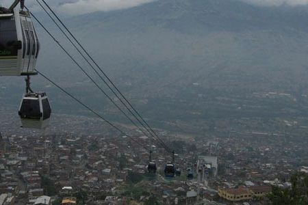 Medellin’s new metro cable system carries commuters in gondolas up a steep mountainside