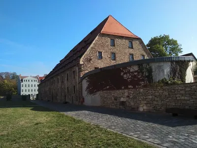 Workers converting a 15th-century granary (large brown building pictured) into a parking garage in Erfurt, Germany, uncovered graves from a medieval Jewish cemetery.