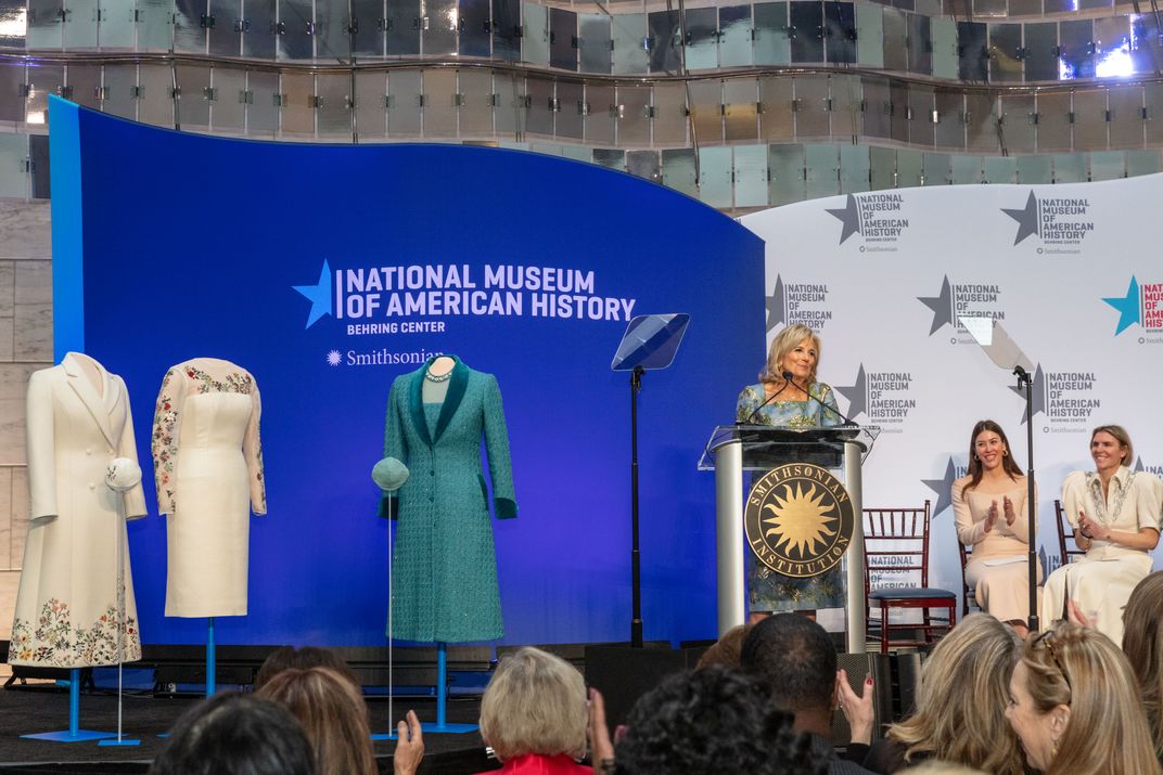 Biden speaks during the January 25 ceremony. Designers Alexandra O'Neill (left) and Gabriela Hearst (right) are seated next to her.