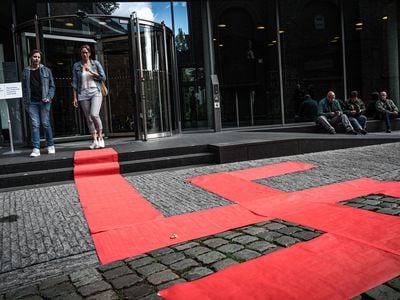 A picture taken on September 8, 2019 shows a Swastika formed with red carpets by artist Ralph Posset during the opening of an exhibition entitled "Design of the Third Reich" at the Design Museum Den Bosch, in 's-Hertogenbosch, central Netherlands. - The exhibition will show the contribution of design to the development of the Nazi ideology.
