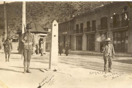A metal obelisk marked the international border in Ambos Nogales circa 1913. American (left) and Mexican (right) sentries patrolled the line.