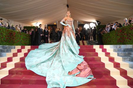 Actress Blake Lively wore a Statue of Liberty&ndash;inspired gown whose copper bow unfurled into a blue-green train.