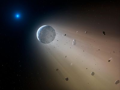 An artist’s rendering shows a white dwarf star shredding a rocky asteroid.