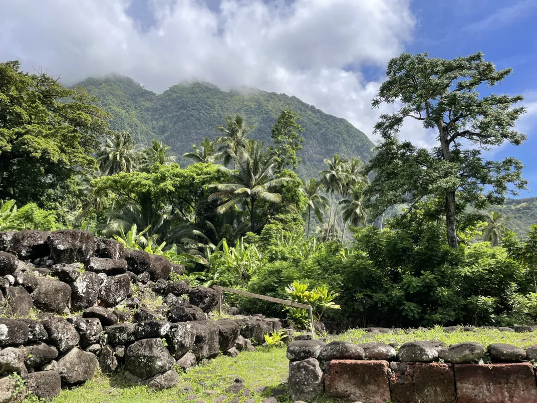 Remnants of archaeological site with lush green foliage surrounding