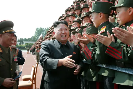 Is this supposed to be a democracy or what? (Shown here: North Korean dictator Kim Jong-un visiting Mangyongdae Revolutionary School in 2014.)