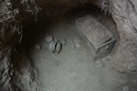 The eight-foot-deep pit contained two ancient coffins and an array of funerary vases.