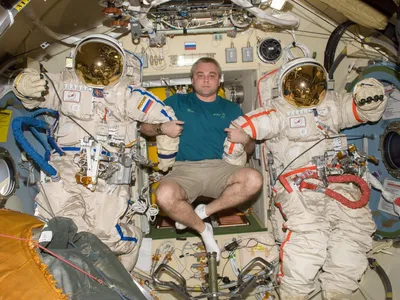 Cosmonaut Maksim Suraev, palling around with two empty spacesuits, was the first Russian to blog from space, giving citizens a look into orbital goings-on.