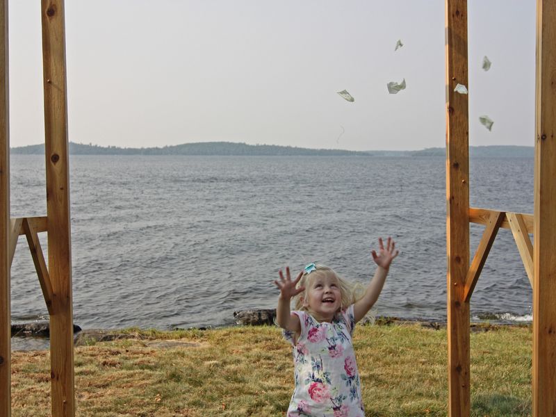 Joyful girl throwing rose petals after a wedding Smithsonian Photo