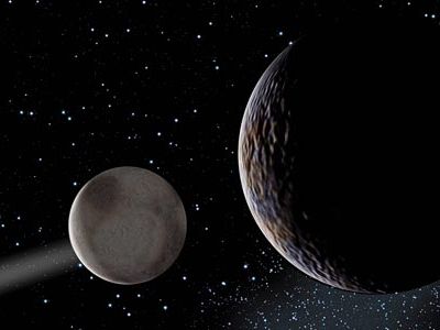 Pluto (smaller sphere) and its moon Charon are the first guideposts of the Kuiper Belt. They may help reveal why planets long ago stopped forming in the outer solar system.