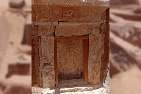 The tomb's entrance is inscribed with protective funerary spells.