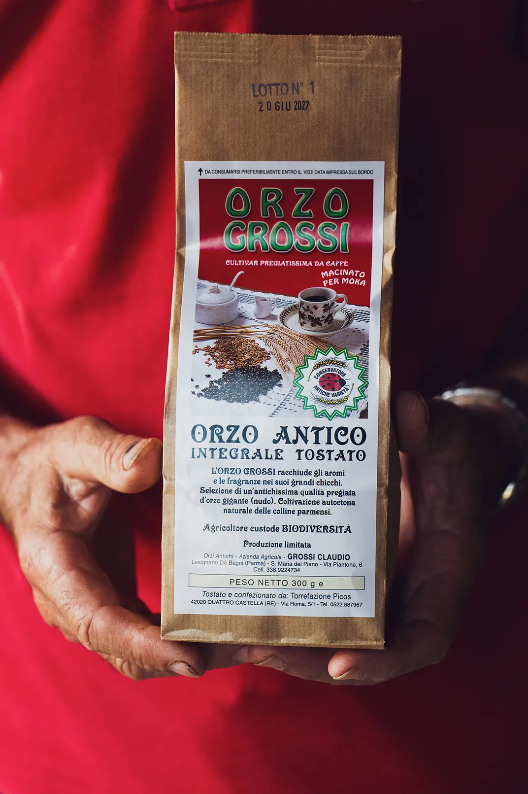 Grossi displays a bag of barley coffee