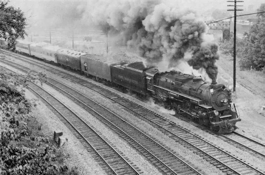 A steam locomotive puffing smoke