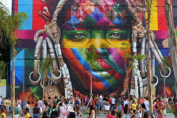 Piercing eyes mesmerize through the bright hues of this artwork that decorates a wall in the port area of Rio de Janeiro.