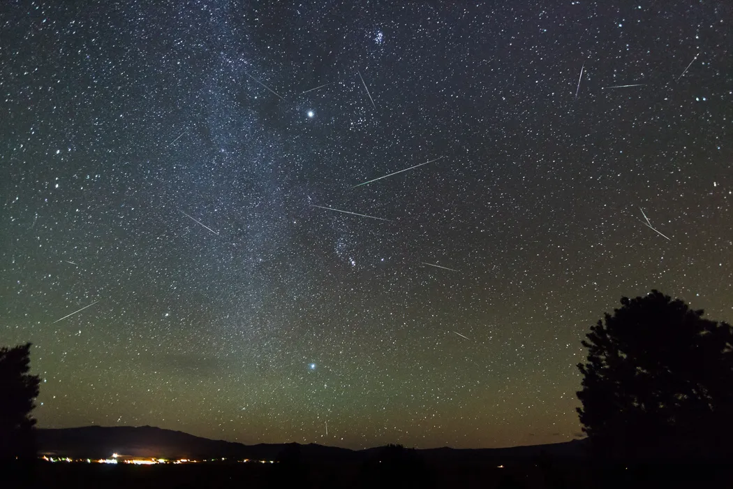 the Orionid meteor shower in a dark, starry sky