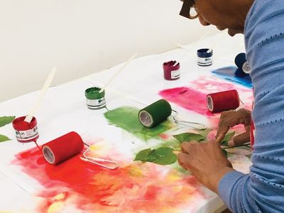 A student learns how to turn spring foliage into botanical watercolors and prints on paper in the Smithsonian Associates studio arts class, Painting and Printing: Leaves Two Ways. (Sue Fierston)