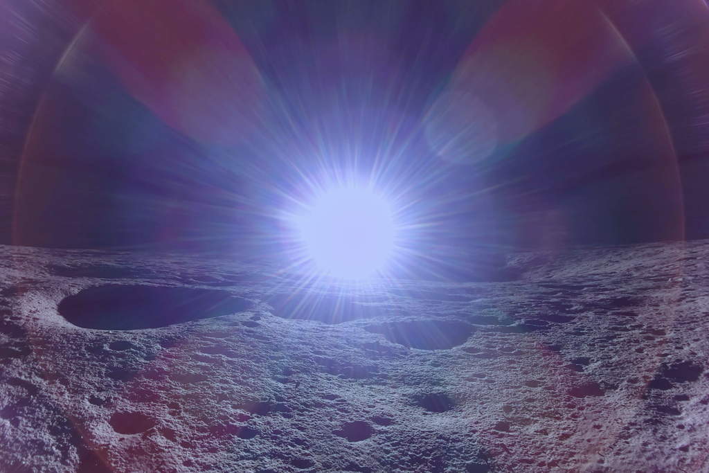 The sun rising over the moon
