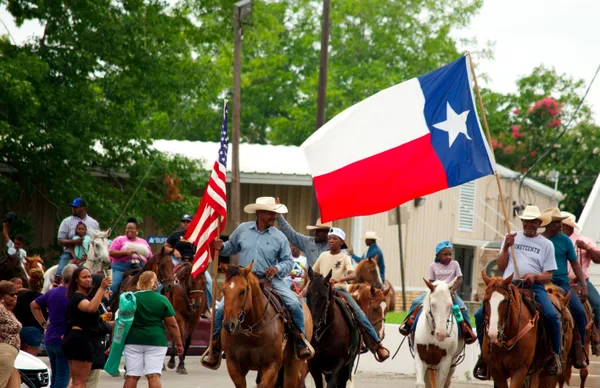 Black cowboys flying the Texas Flag thumbnail