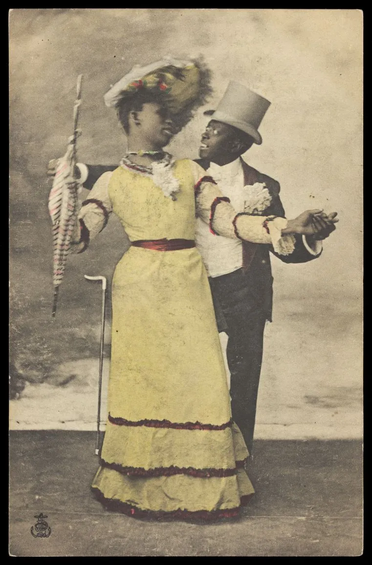 A circa 1903 postcard depicting Black actors, one in drag, dancing together