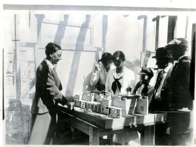 Alice Constance Austin showing model of house to Llano del Rio colonists, May 1, 1917. 