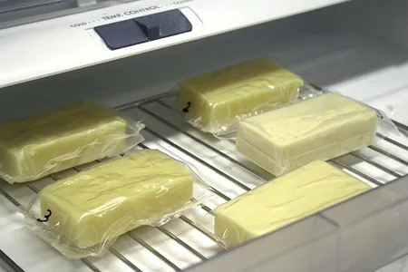 The casein film can either be used as wrappers, like this, or it can be sprayed onto food.
