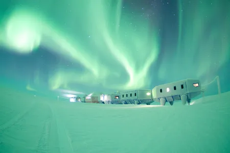 The Halley VI Research Station underneath the aurora in Antarctica. 