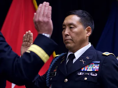 Alaska Army National Guard Col. Wayne Don, then 38th Troop Command commander, pledges the Oath of Office, administered by Alaska Army National Guard Brig. Gen. Joseph Streff, Alaska Army National Guard commander, after Don was promoted to full colonel. Dena'ina Center, Anchorage, July 14, 2017.  (U.S. Army photo by Sgt. David Bedard)