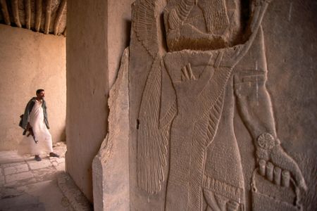 A guard patrolling the ruins of Nimrud in 1995