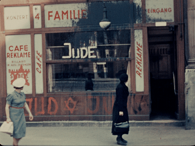 Women observe anti-Semitic graffiti in Vienna in a film shot by an American in 1938. 