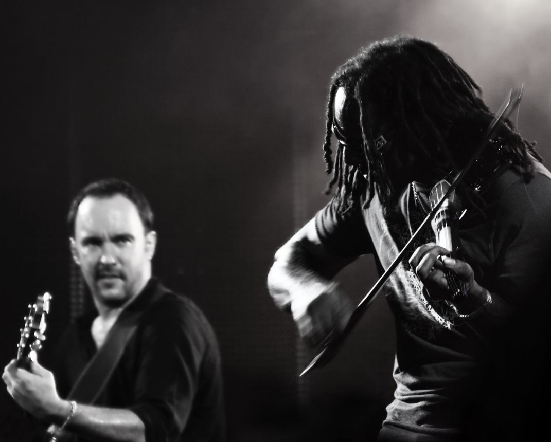 Guitarist Dave Matthews and Violinist Boyd Tinsley play live on stage ...