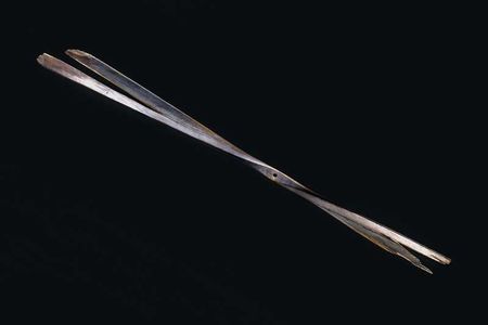 The breakthrough propeller, its blades shaped by hatchet and drawknife from two-ply spruce, was sheathed in linen and sealed with aluminum powder mixed  into a heavy varnish.